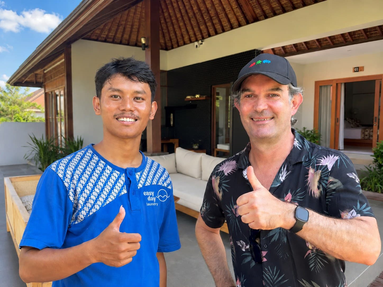 Easy Day Laundry team member with a long-stay expat resident at a Bali villa