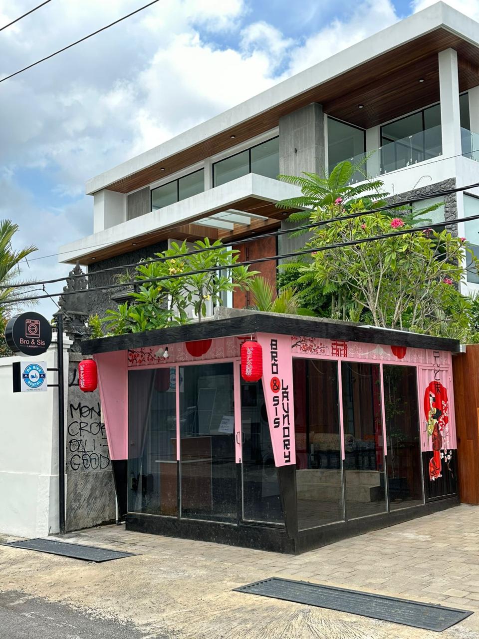 Bro & Sis Laundry pink Japanese-themed storefront in Tumbak Bayuh